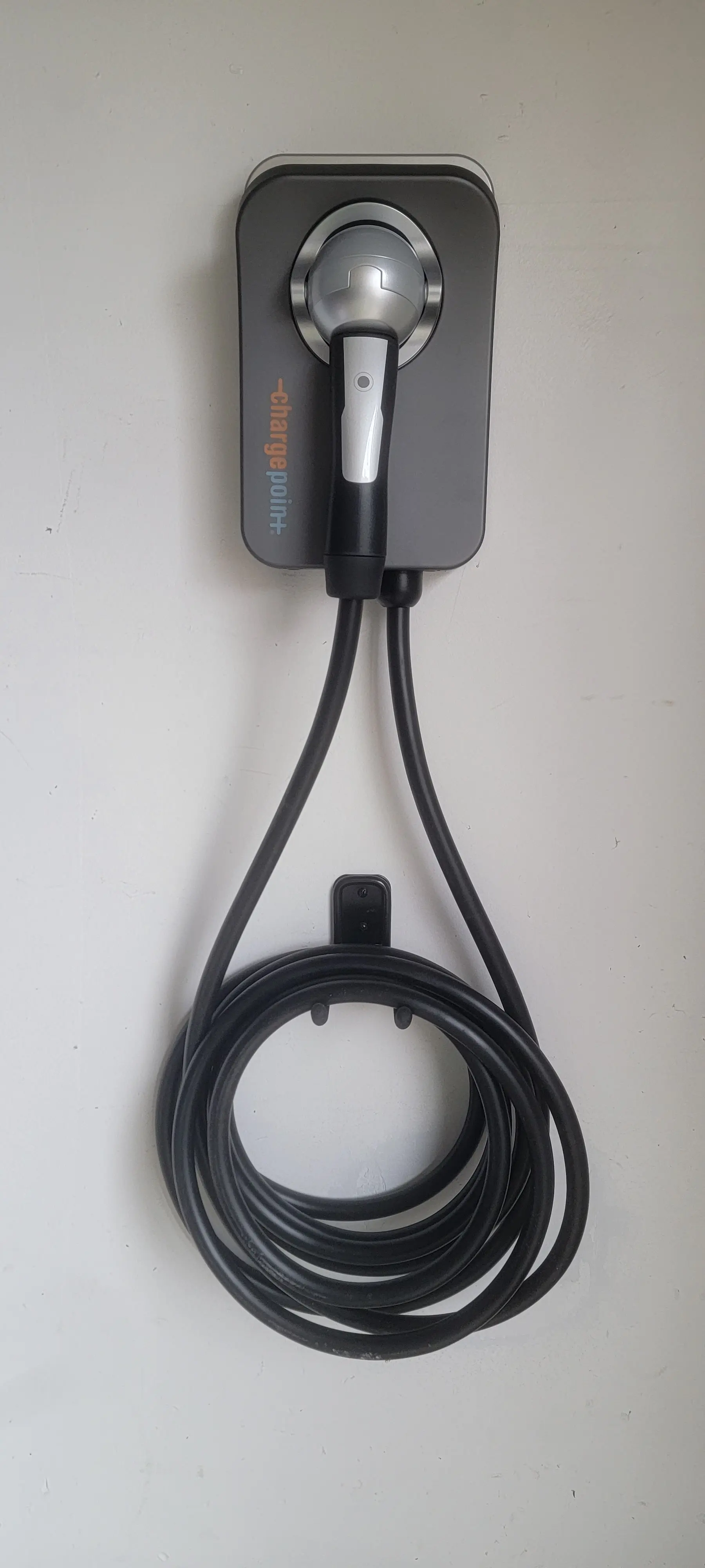 ChargePoint EV charger mounted on an interior wall of a home