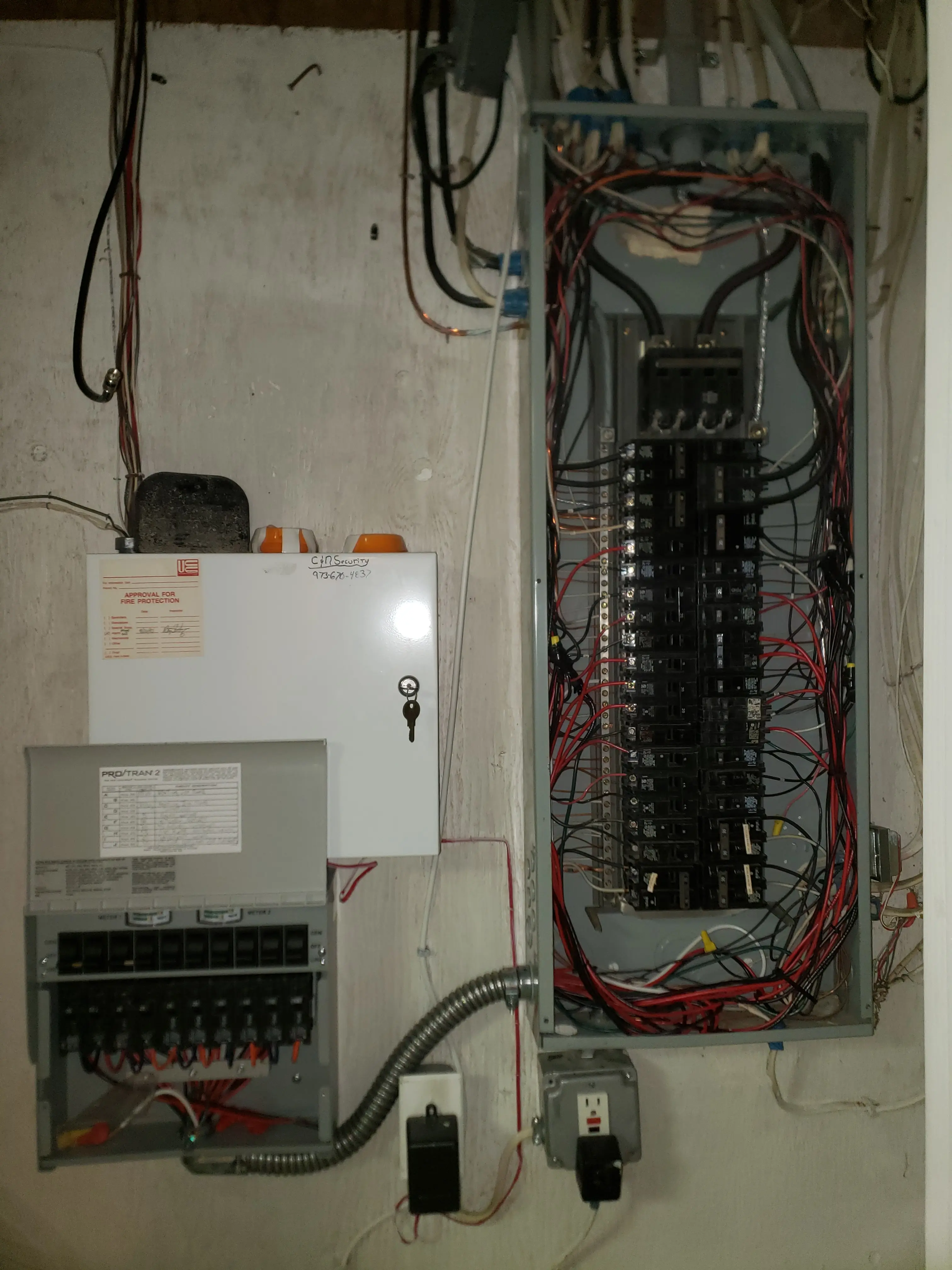 Open residential electrical panel with wiring exposed during panel service and troubleshooting