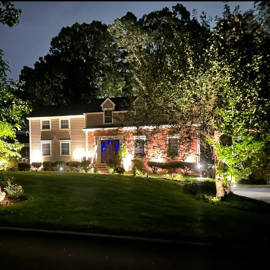 Residential home with exterior facade and pathway lighting
