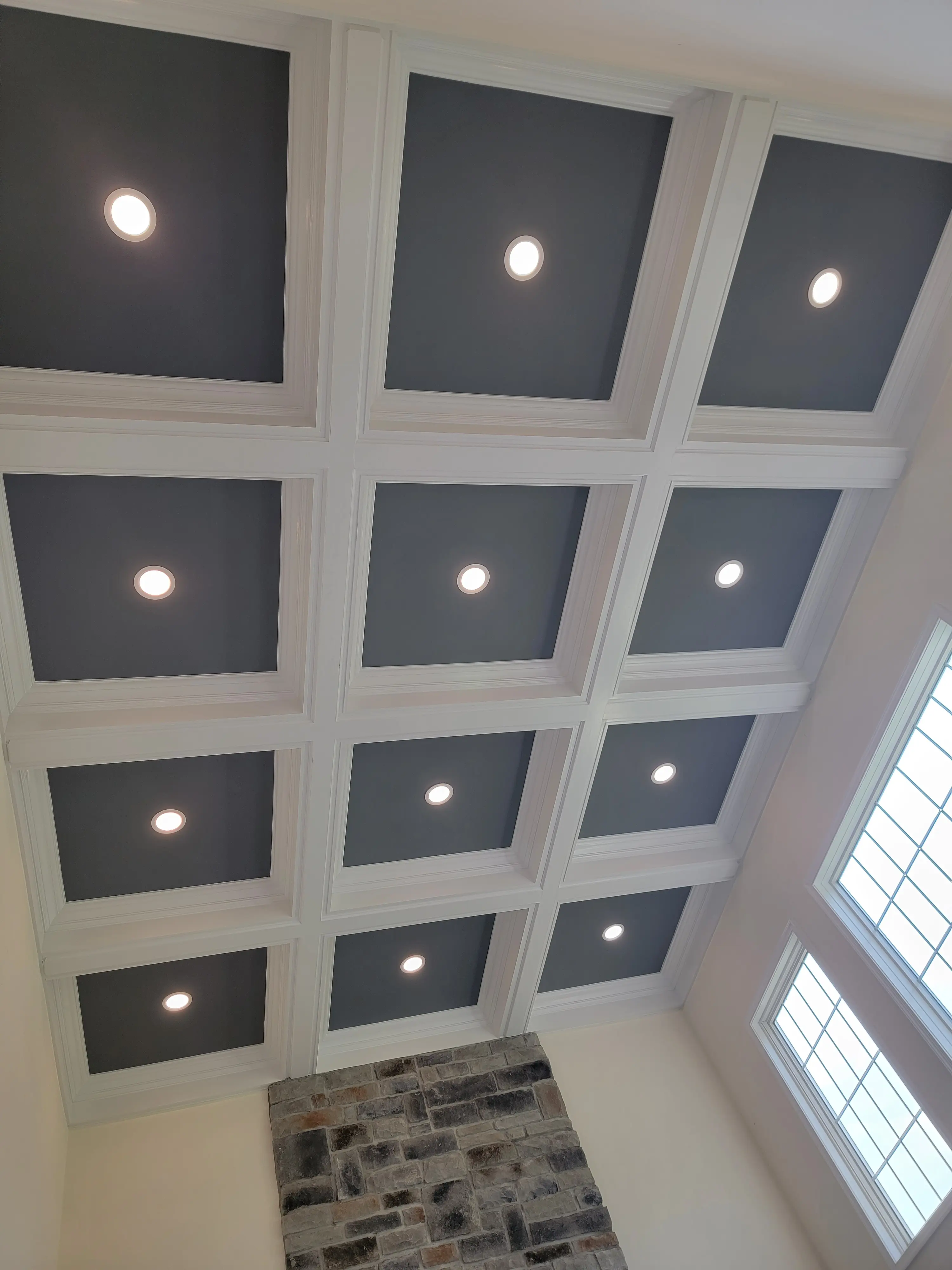 Recessed lighting integrated into a coffered ceiling