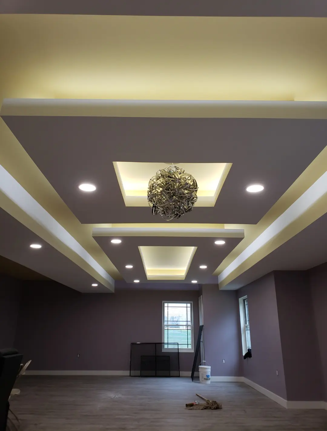 Close-up detail of recessed lighting along a cove ceiling