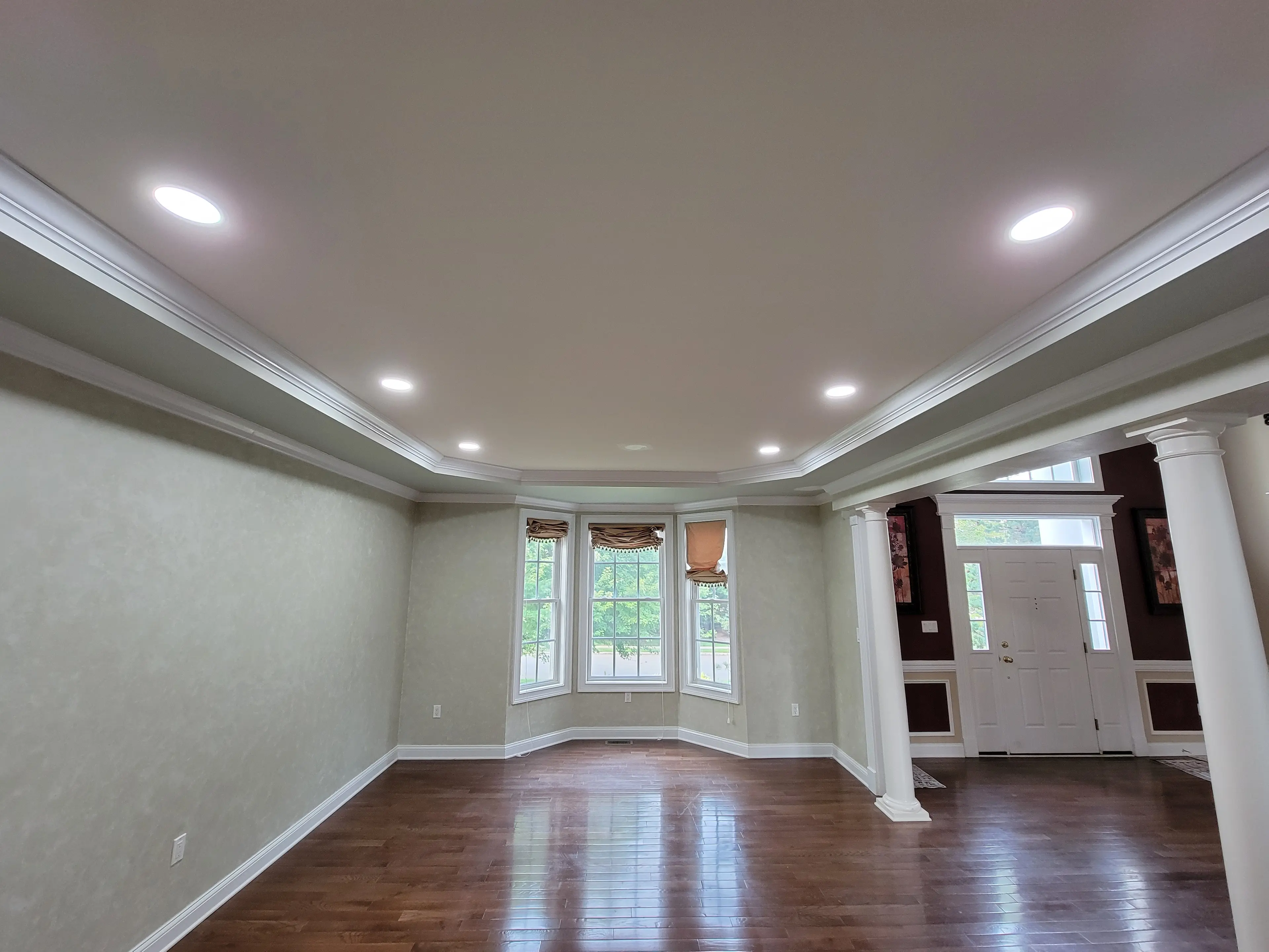 Finished living room with recessed ceiling lighting