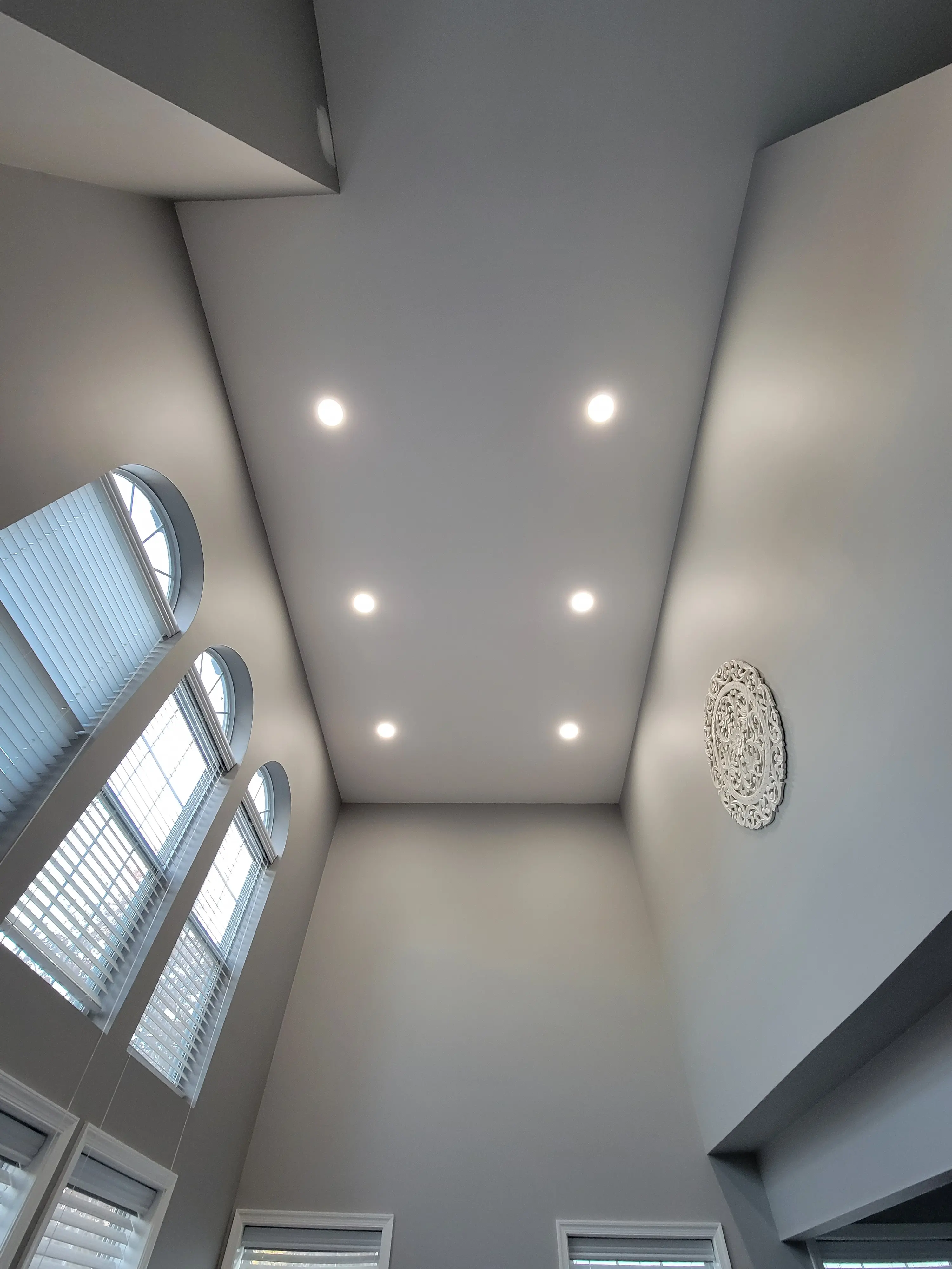 Recessed lighting installed on a high residential ceiling