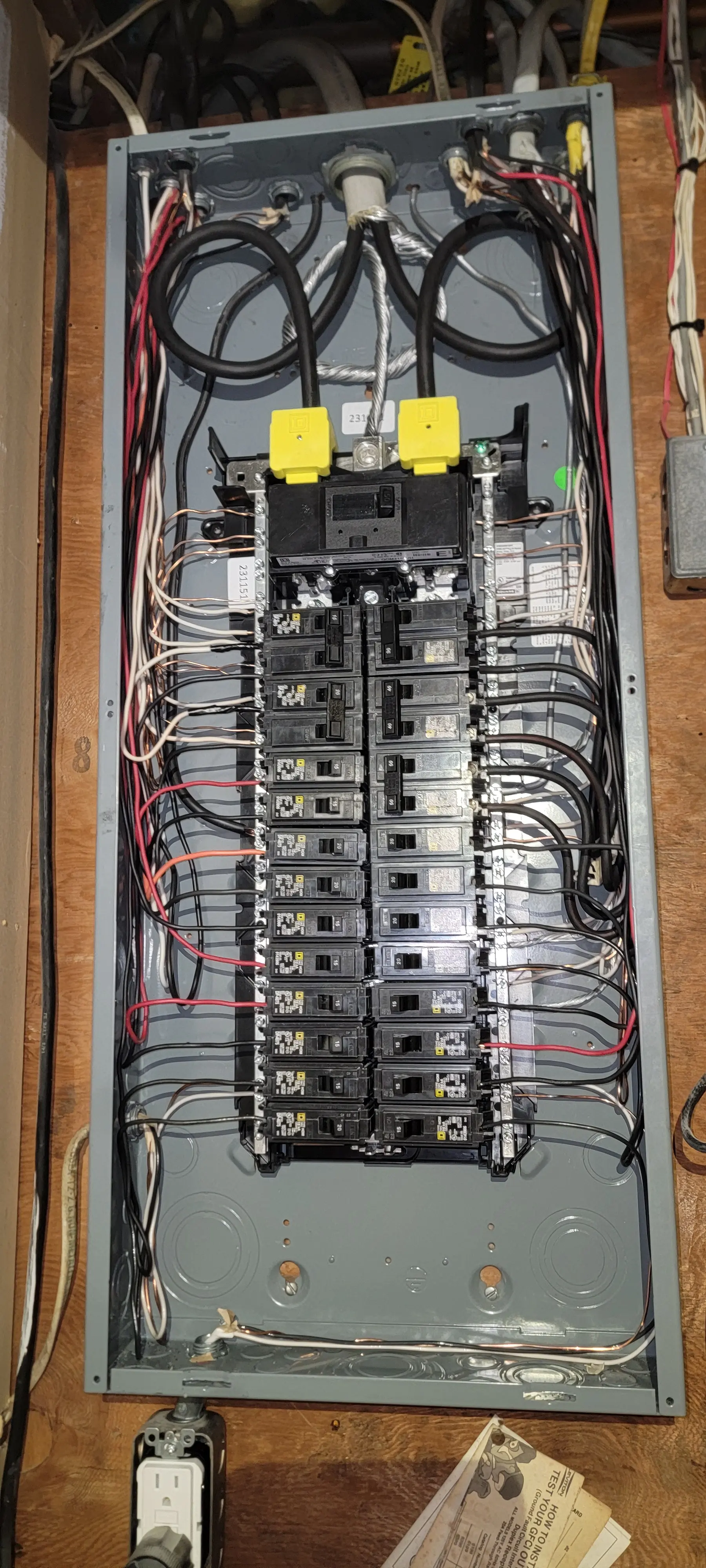 Close-up of wiring and breakers inside a residential electrical panel