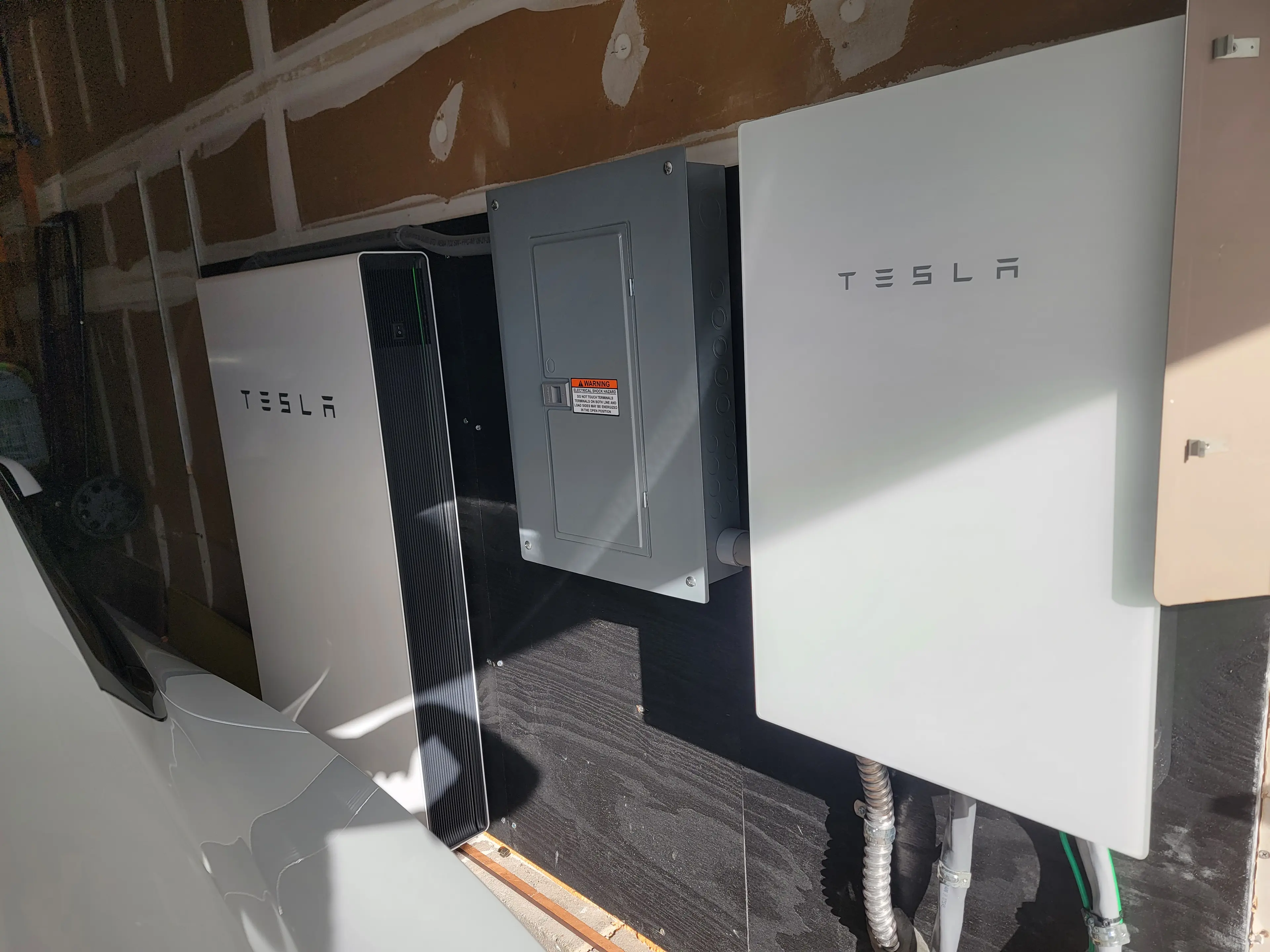 Electrical panel and Tesla equipment installed as part of a residential EV charging setup